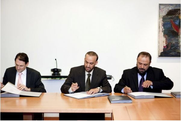 A person signing a printed contract